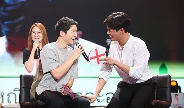 Song Joong-Ki and Park Bo-Gum laugh during the fan meeting of the latter in Bangkok, Thailand on Feb. 11, 2017.