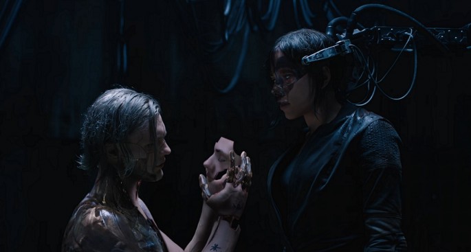 The Major (R) confronts the villain, Kuze, in the live-action adaptation of 'Ghost in the Shell.'