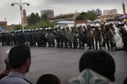 Anti-riot personnel guard the Xinjiang area as threats from terrorists rise.