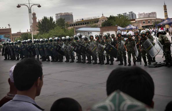 Anti-riot personnel guard the Xinjiang area as threats from terrorists rise.