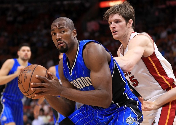 Serge Ibaka of the Orlando Magic posts up Luke Babbitt of the Miami Heat during a game at American Airlines Arena on February 13, 2017 in Miami, Florida. 