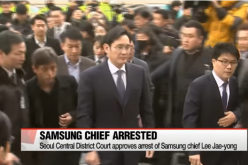 Samsung's Lee Jae-yong as he is being accompanied by his security details. 