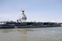 USS Gerald R. Ford being towed.               