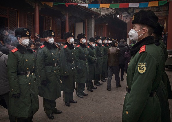 Chinese paramilitary police undertake crowd control duties on the first day of the Chinese Lunar New Year.