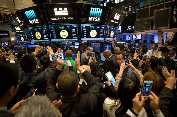 Traders work on the floor during the IPO of China Online Education Group at the New York Stock Exchange.