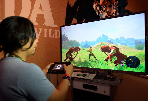 Gamers try out the new to play the new video game 'The Legend of Zelda: Breath of the Wild' in the Nintendo booth during the annual E3 2016 gaming conference at the Los Angeles Convention Center on June 14, 2016 in Los Angeles, California.