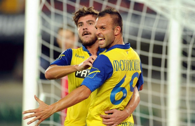 Chievo forward Riccardo Meggiorini (R) with teammate Alberto Paloschi.