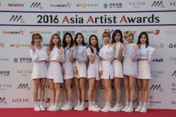 South Korean K-pop group TWICE members pose on the red carpet of the '2016 Asia Artist Awards' in Seoul, South Korea, on Nov. 16, 2016.   