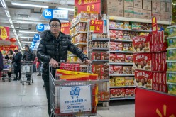 Walmart stores are decorated with Chinese lanterns and discount posters to attract customers.