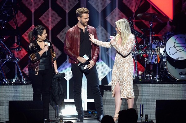 Radio personality Sisanie, 'The Bachelor' star Nick Viall and radio personality Tanya Rad speak onstage during 102.7 KIIS FM's Jingle Ball 2016 at Staples Center on December 2, 2016 in Los Angeles, California.