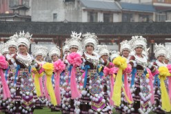 Women of Miao ethnic group dance at a square in Rongshui county, Guangxi Zhuang autonomous region, on March 7, to celebrate the International Women's Day. 