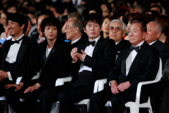 (L-R) Actor Kim Min-Joon, Kang Dong-Won, Seol Kyung-Ku and Festival director Kim Dong-Ho attend the closing ceremony of the 15th Pusan International Film Festival.