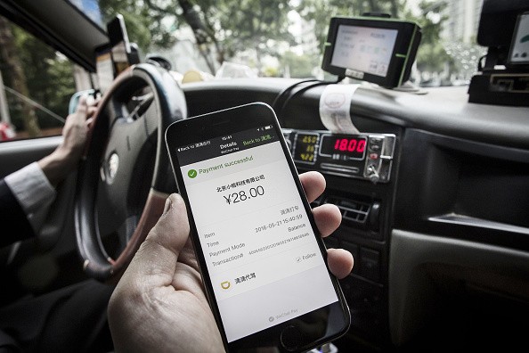 The payment confirmation page is displayed on the Didi Chuxing application in this arranged photograph taken in Shanghai, China.