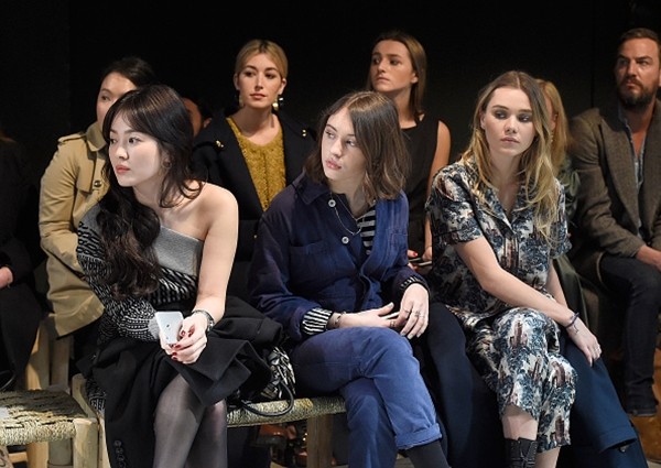 Song Hye Kyo, Iris Law and Immy Waterhouse wearing Burberry attend the Burberry February 2017 Show during London Fashion Week February 2017 at Makers House on February 20, 2017 in London, England. 