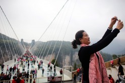 China's 430-Meter-Long Glass Bottom Bridge Opens Again to Tourists