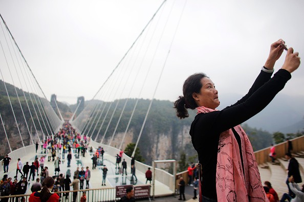China's 430-Meter-Long Glass Bottom Bridge Opens Again to Tourists