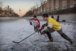 Chinese Men Play Ice Hockey in Beijing
