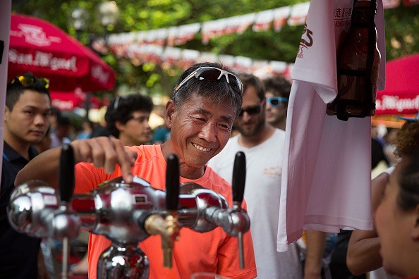 A man orders San Miguel Beer in an event in Hong Kong.