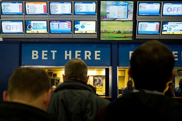 Racegoers in the betting shop area at Sandown Park on February 4, 2017 in Esher, England.