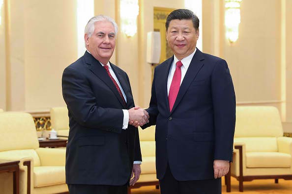 U.S. Secretary of State Rex Tillerson shakes hands with Chinese President Xi Jinping.