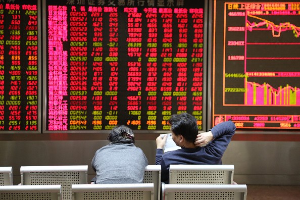 Investors observe stock market movements at an exchange hall on Jan. 6, 2016, in Beijing, China.