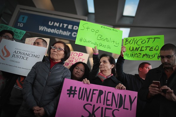 Asians hold protests at the O'Hare Airport Terminal when a Vietnamese doctor was dragged off a United Airlines flight.
