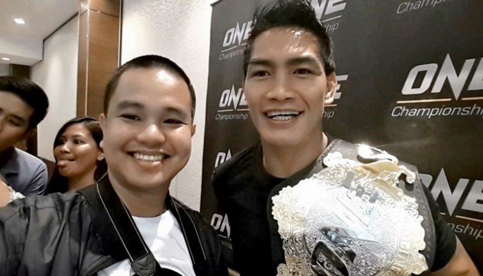 Conan Altatis poses with ONE lightweight world champion Eduard 'Landslide' Folayang during the Team Lakay Media Day on May 9, 2017 at Vikings Venue at SM Mall of Asia Bayside, Pasay City, Philippines. 