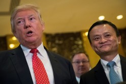 Alibaba founder Jack Ma (R) is facing criticism from Capitol Hill for the acquisition of MoneyGram by Ant Financial, an Alibaba subsidiary.