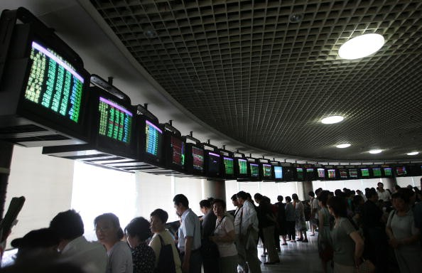 Investors gather to view the stock index at a securities company on May 30, 2007 in Nanjing, China.