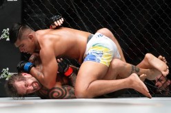 Brad Robinson (bottom) of United States of America fights Agilan Thani of Malaysia in the catchweight bout at 'One Championship: Ascent to Power' at Singapore Indoor Stadium in Singapore on May 6, 2016.