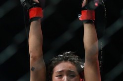 Singapore's Angela Lee celebrates after defeating Japan's Mei Yamaguchi in the women's atomweight world championship bout at 'One Chamionship: Ascent to Power' at Singapore Indoor Stadium in Singapore on May 6, 2016.