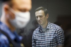 Russian opposition politician Alexei Navalny attends a hearing to consider an appeal against an earlier court decision to change his suspended sentence to a real prison term, in Moscow, Russia