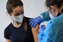 A German police staff member receives AstraZeneca's vaccine against the coronavirus disease (COVID-19), in Munich, Germany,