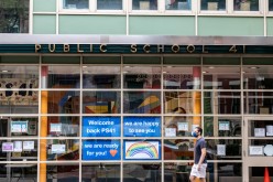 A pedestrian walks past Public School 41 following the outbreak of the coronavirus disease (COVID-19) in the Manhattan