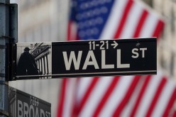 The Wall Street sign is pictured at the New York Stock exchange (NYSE) in the Manhattan borough of New York City, New York, U.S.,