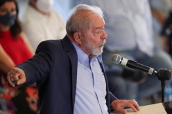 Brazil's former President Luiz Inacio Lula da Silva gestures as he speaks during a news conference