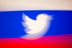 Twitter logo and a Russian flag are displayed in this illustration picture taken 