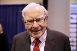 Berkshire Hathaway Chairman Warren Buffett walks through the exhibit hall as shareholders