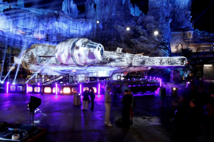 Guests explore "Star Wars: Galaxy's Edge" near a Millennium Falcon starship at Disneyland Park in Anaheim, California, U.S.,
