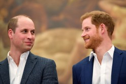 Britain's Prince William and Prince Harry attend the opening of the Greenhouse Sports Centre in central London, 