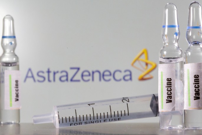 A test tube labelled "vaccine" in front of an AstraZeneca logo in this illustration taken, 