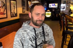 Aric Nowicki, who plans to use his stimulus check to pay overdue bills, is seen in a bar in Reedsburg, Wisconsin, U.S.