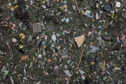 An aerial view shows domestic waste floating on the stream of the Citarum river in Bandung,