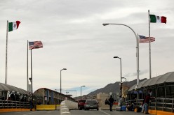 People queue to cross into the U.S. at the Paso del Norte border crossing bridge, as seen from Ciudad Juarez, Mexico