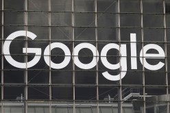 The logo of Google is seen on a building at La Defense business and financial district in Courbevoie near Paris, France,