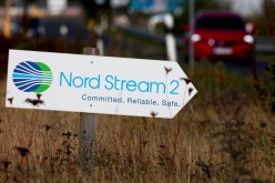 A road sign directs traffic towards the Nord Stream 2 gas line landfall facility entrance in Lubmin, Germany,