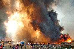 Smoke billows at the site of the Rohingya refugee camp where fire broke out in Cox's Bazar,