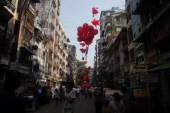 Protesters release red balloons during a protest against the military coup in Yangon, Myanmar,