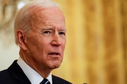 U.S. President Joe Biden speaks to reporters as he holds his first formal news conference in the East Room of the White House in Washington, U.S., 