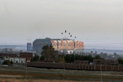 Stranded container ship Ever Given, one of the world's largest container ships, is seen after it ran aground, in Suez Canal, Egypt